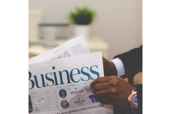 Man reading business newspaper